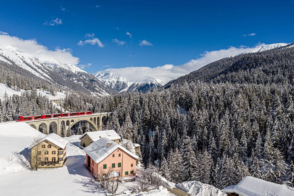 From Milan: Bernina Red Train to St Moritz Guided Tour - The Bernina Express ride: red coaches, steep climbs, big windows