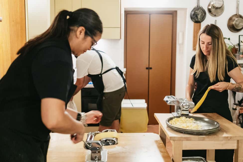 Milan: Pasta & Tiramisu Cooking Class with Premium Products - When you sit down: family-style eating with wine