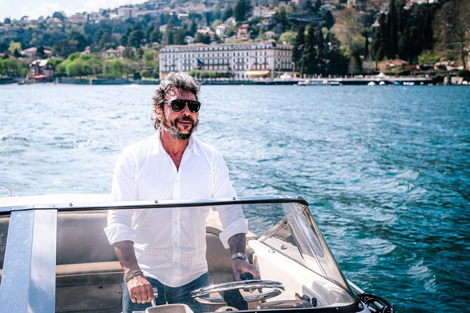 Private Boat Tour with Open Bar Lake Como 7 Pax - From Como to Life Electric: the opening skyline and modern art contrast